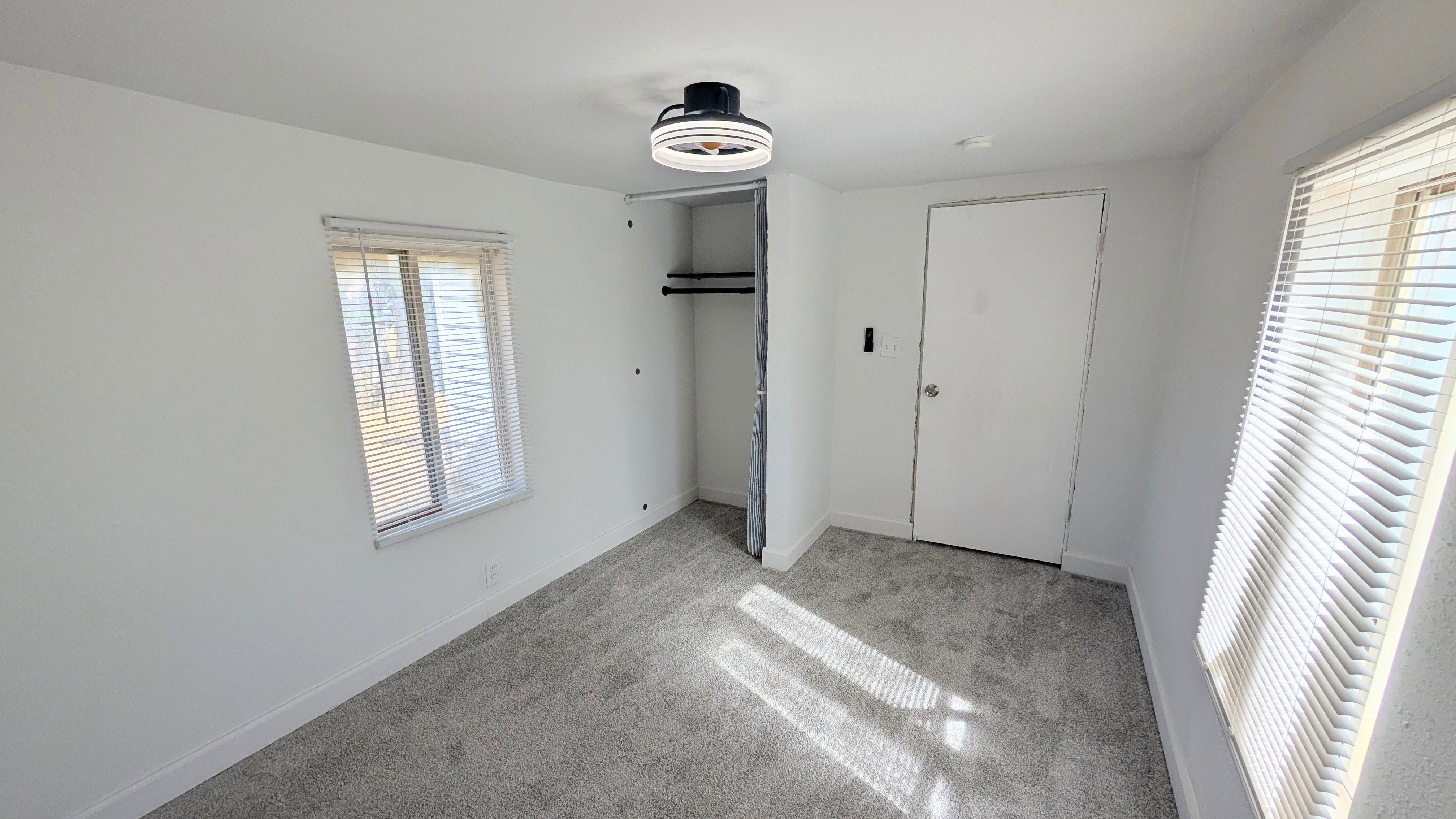 Unfurnished bedroom with carpet floors and a closet