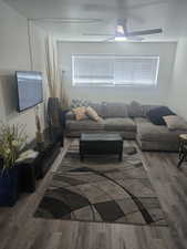 Living area featuring wood finished floors and healthy amount of natural light