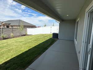 Fenced backyard with a patio area