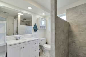 Bathroom featuring vanity and walk in shower