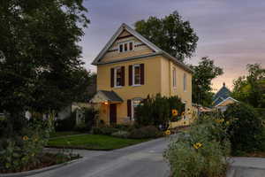Victorian home featuring a yard