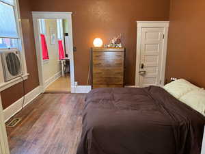 Bedroom featuring hardwood / wood-style flooring and a closet