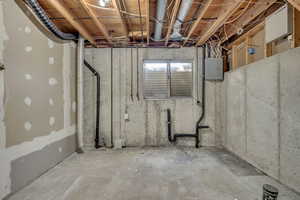 Below grade area featuring electric panel