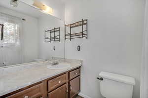 Bathroom featuring toilet and vanity