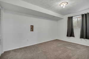 Empty room with carpet floors