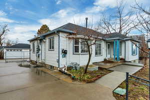 View of front of property with a gate and a double garage.