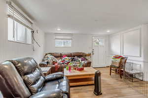 Unit C living area featuring lvp finished floors and a decorative wall.
