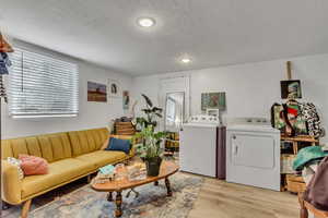 Unit B laminate flooring, and washer and dryer.