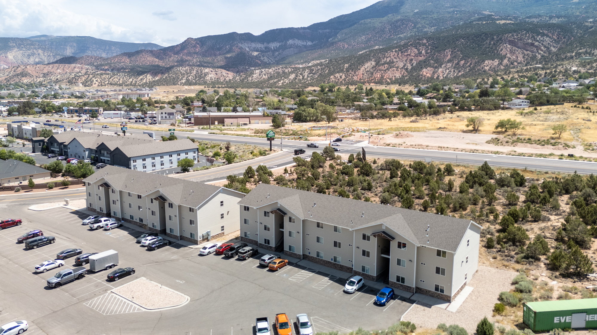 Aerial view of residential area featuring a mountain backdrop
