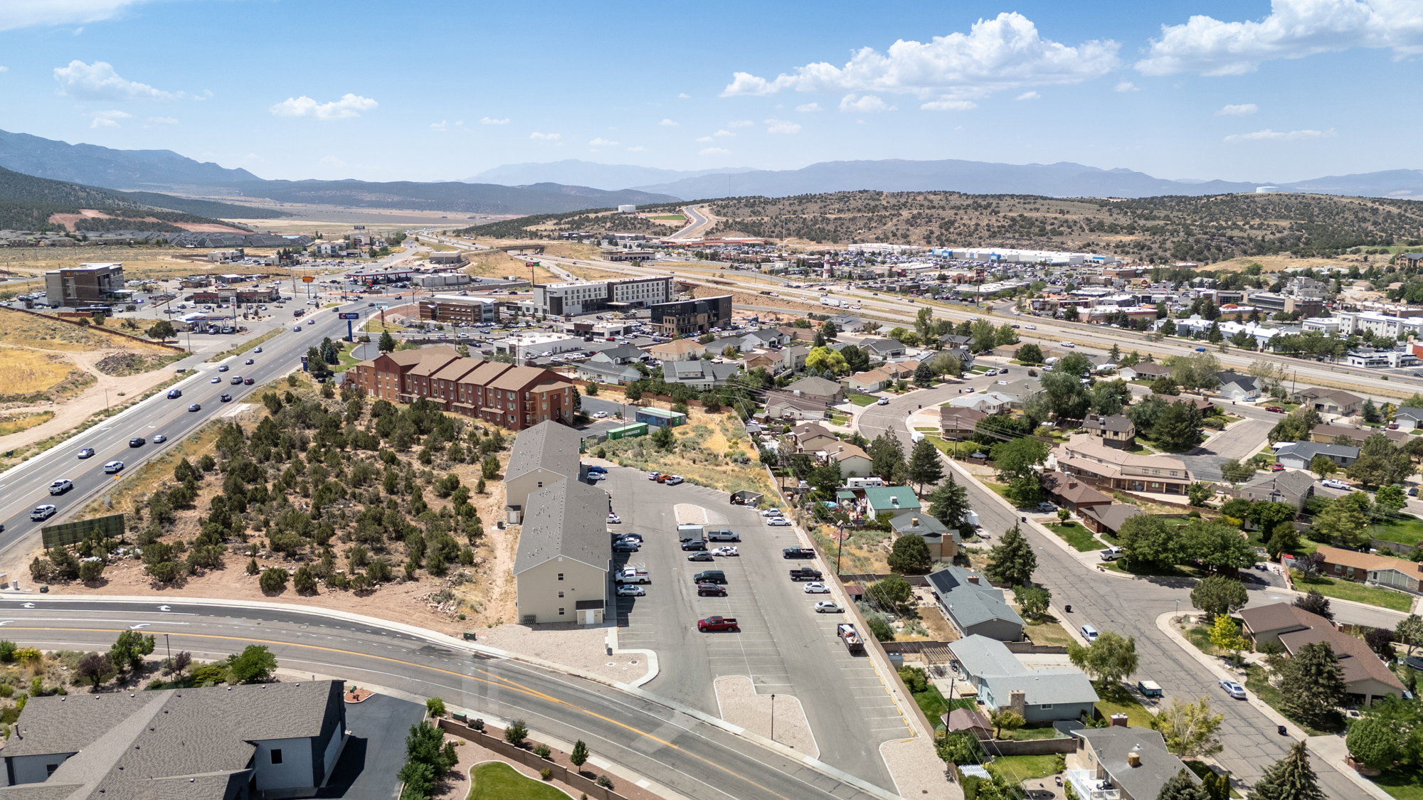 Bird's eye view of a major roadway and a mountainous background