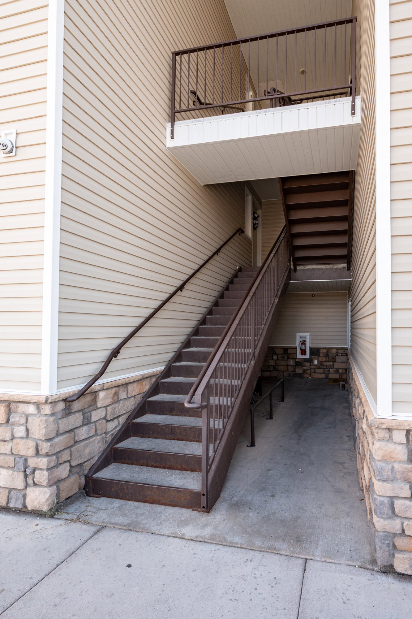 View of exterior entry with stone siding