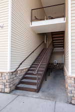 View of exterior entry with stone siding