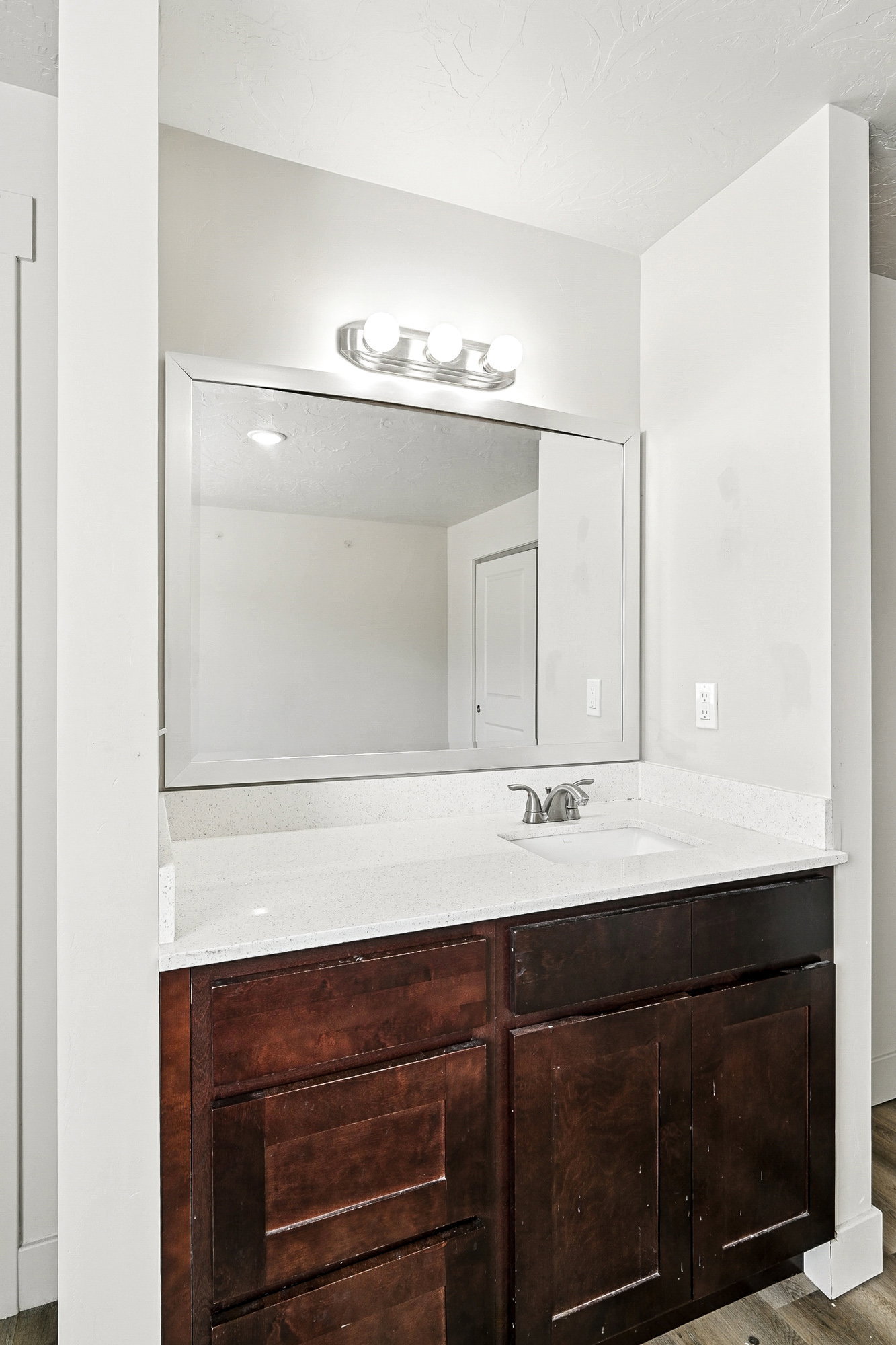 Bathroom with vanity and light wood-type flooring
