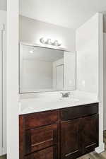 Bathroom with vanity and light wood-type flooring