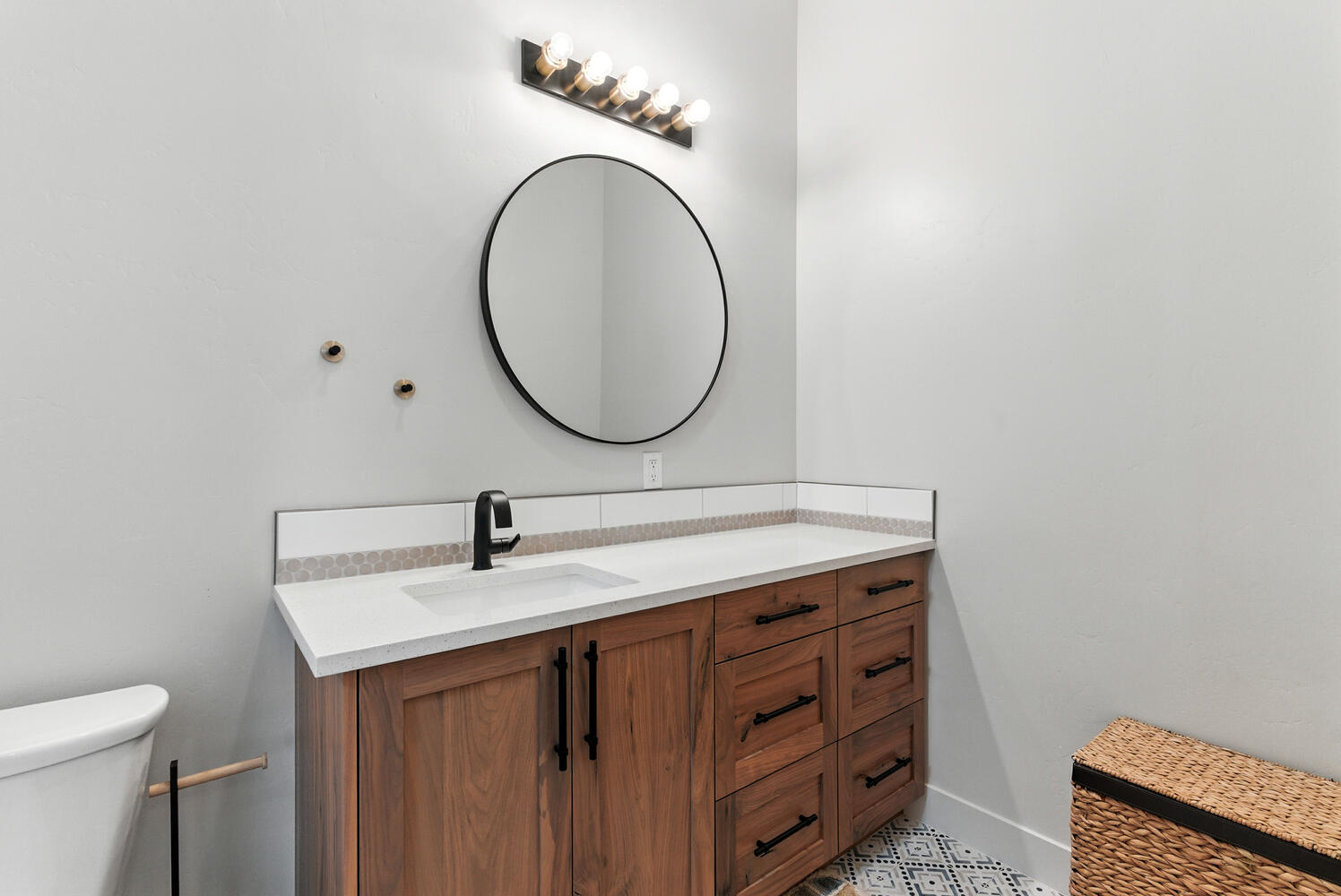 Half bathroom featuring vanity and toilet