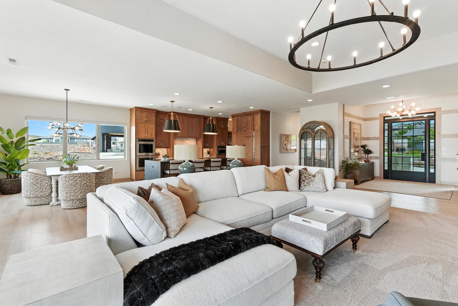 Living room with a chandelier, recessed lighting, and wood finished floors