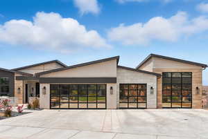 Contemporary home featuring a garage and driveway