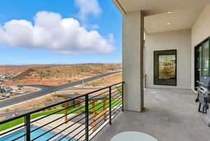 Balcony featuring area for grilling