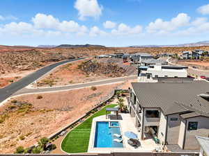 View of subject property with a pool area and a mountain backdrop
