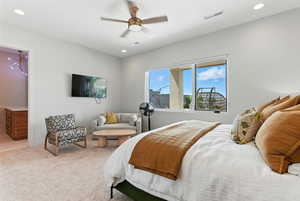 Carpeted bedroom featuring recessed lighting and a ceiling fan
