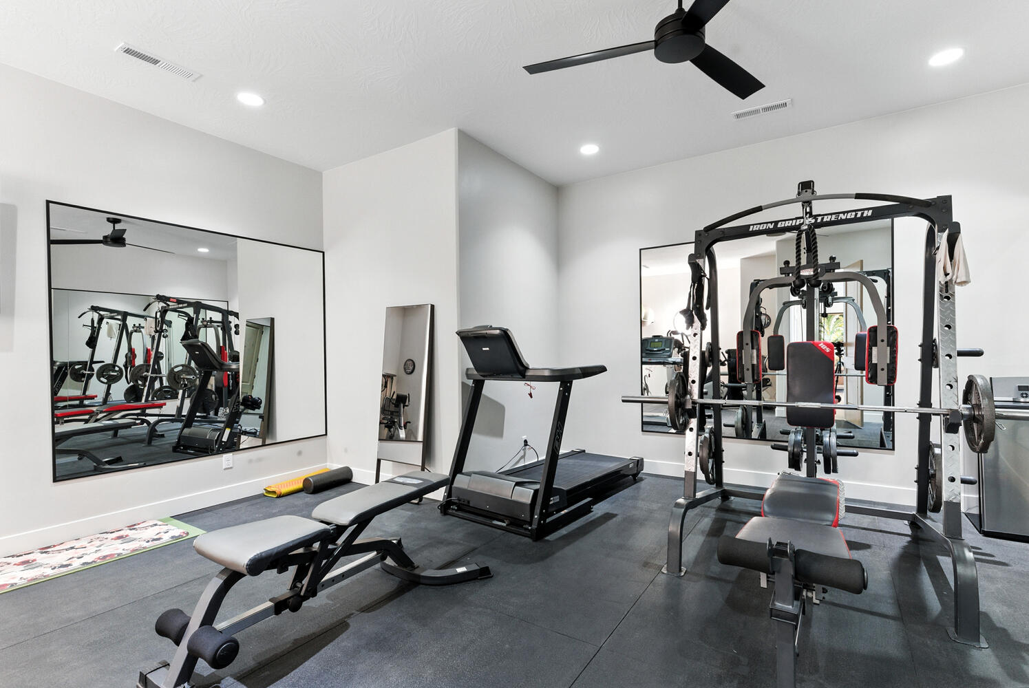 Exercise room with ceiling fan and recessed lighting
