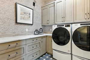 Laundry area featuring separate washer and dryer