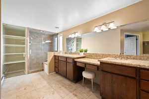 Primary Suite with double vanity and separate tub and shower