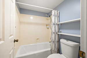 Full bathroom with toilet/tub & shower room and  separate double vanity area