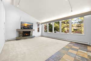 * TV Included! * Vaulted ceiling, gas remote controlled fireplace, and large windows.