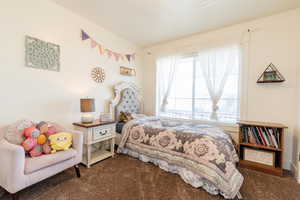 Bedroom featuring carpet floors
