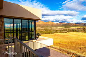 Exterior space with a balcony and a mountain view