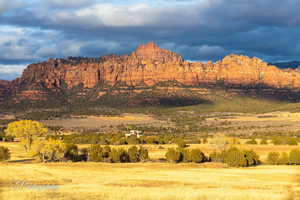 View of mountain backdrop with rural landscape