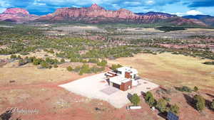 View of subject property featuring a mountainous background