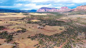 View of mountain background featuring rural landscape