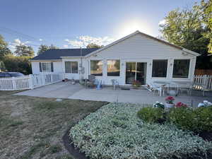 Rear view of property with a patio area