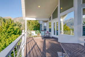 Upper level deck featuring a mountain view