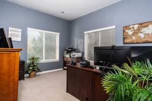 Office featuring light carpet and baseboards