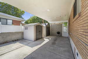 View of patio / terrace featuring a shed