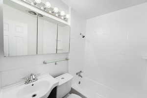 Bathroom featuring  shower combination and vanity