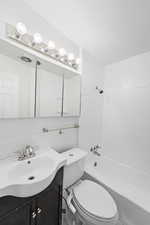Bathroom featuring shower / bath combination and vanity