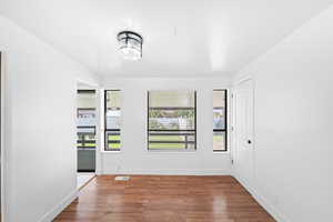 Spare room with wood finished floors and baseboards