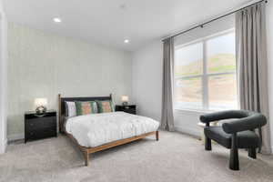 Carpeted bedroom with wallpapered walls, an accent wall, and recessed lighting