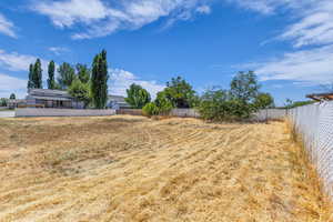 View of fenced backyard