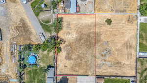 Aerial view of property and surrounding area with property boundaries highlighted