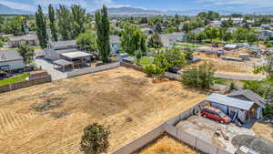 Aerial perspective of suburban area featuring a mountain backdrop