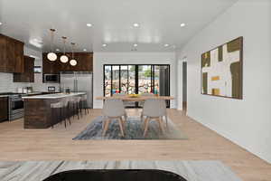 Dining area featuring recessed lighting and light wood-style floors