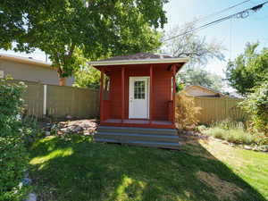 View of outbuilding with a fenced backyard