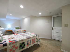 Bedroom featuring light carpet and recessed lighting