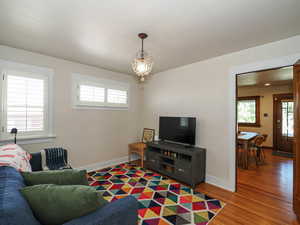 Living room with wood finished floors and baseboards