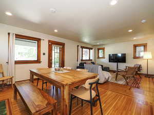 Dining area with plenty of natural light, recessed lighting, and light wood-style flooring